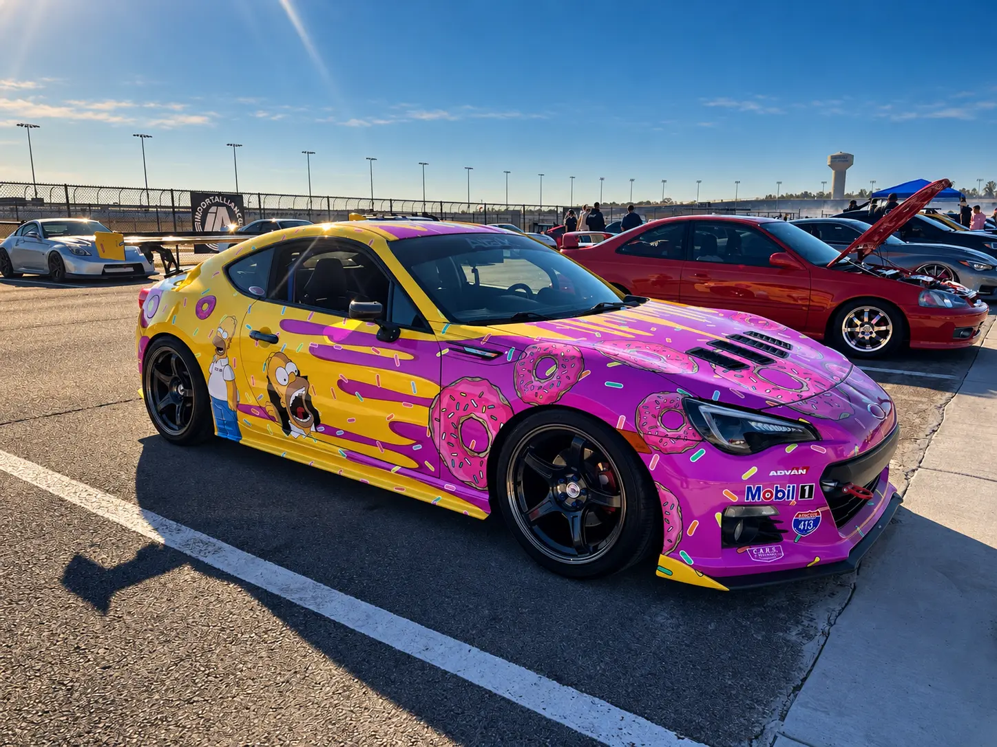 Colorful custom coupe with pink and yellow graphics at ImportAlliance Nashville Fall 2026
