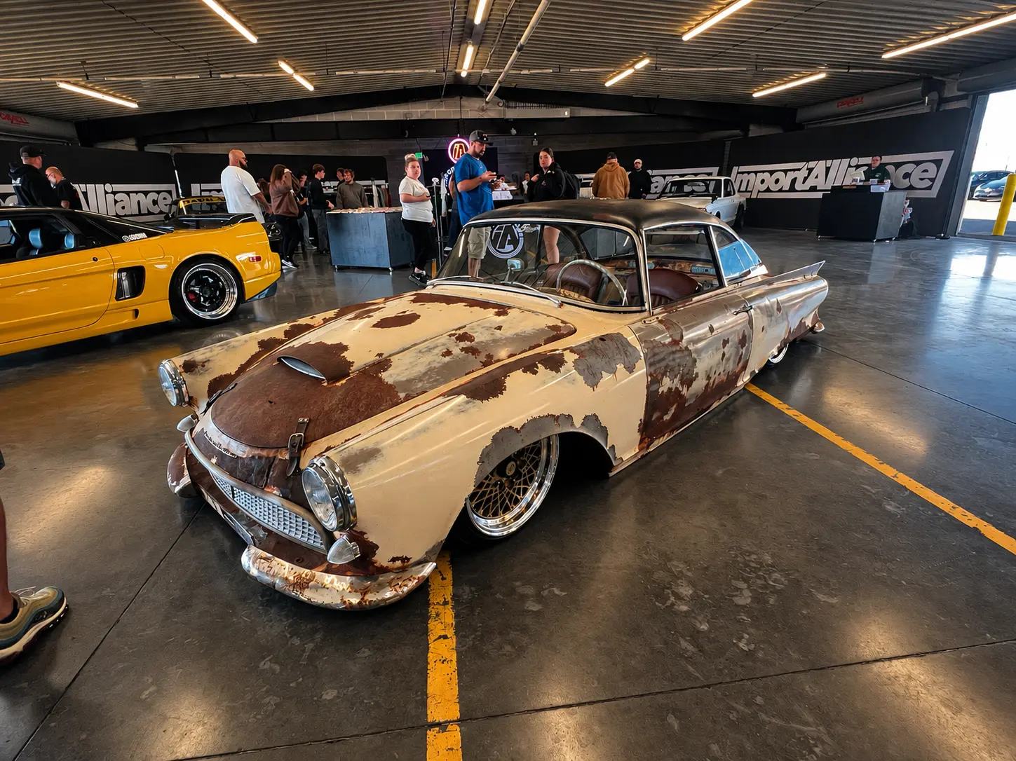 Patina lowrider displayed inside the ImportAlliance hall at ImportAlliance Nashville Fall 2026